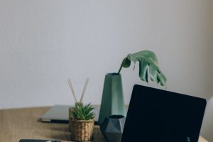 Free Black Laptop Computer On Brown Wooden Table Stock Photo