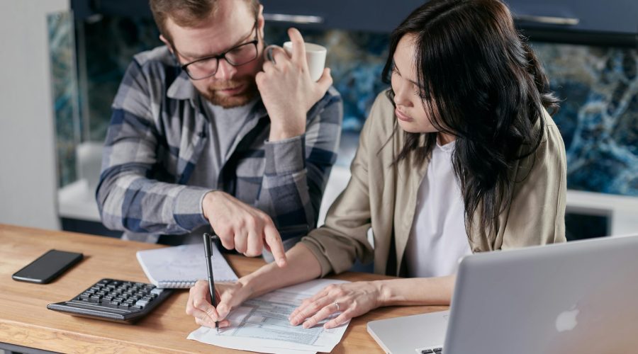 Free couple calculating al their bills stock photo